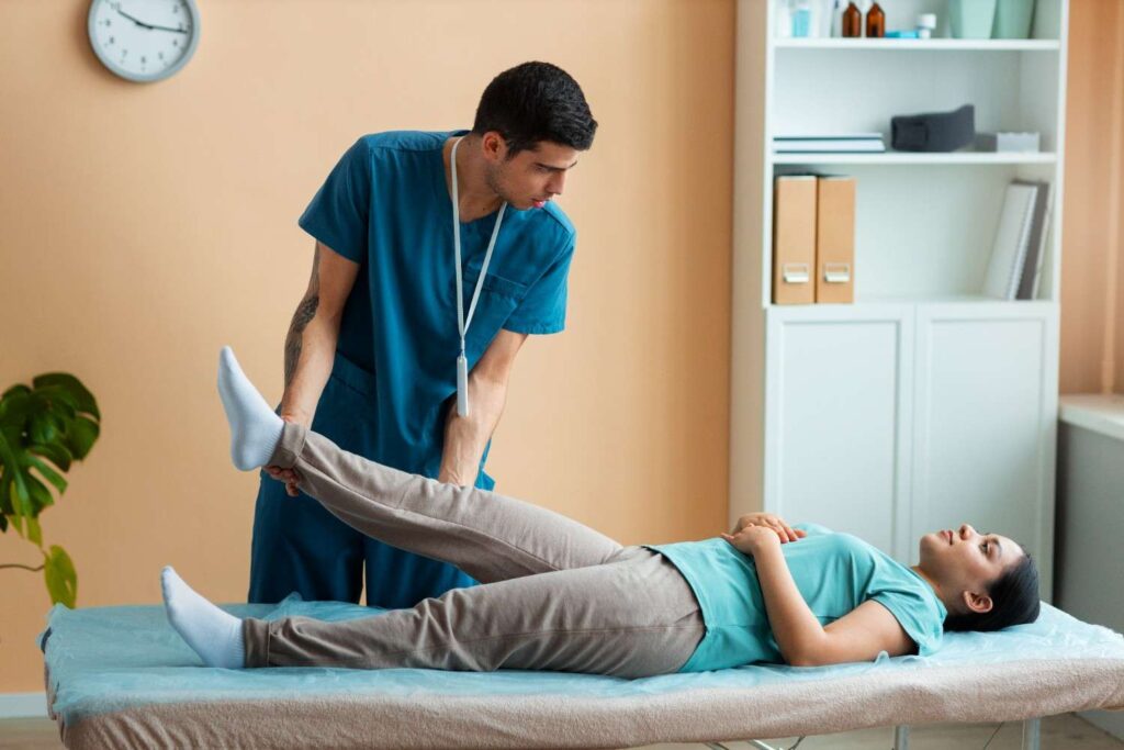 doctor-helping-patient-rehabilitation (1)